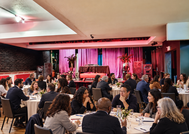 An audience gathered for an in-person conference